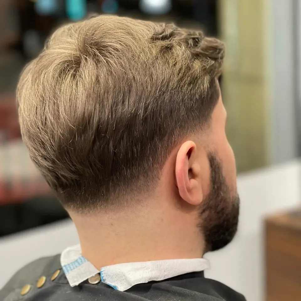 A tapered cut seen from the back, finished and styled